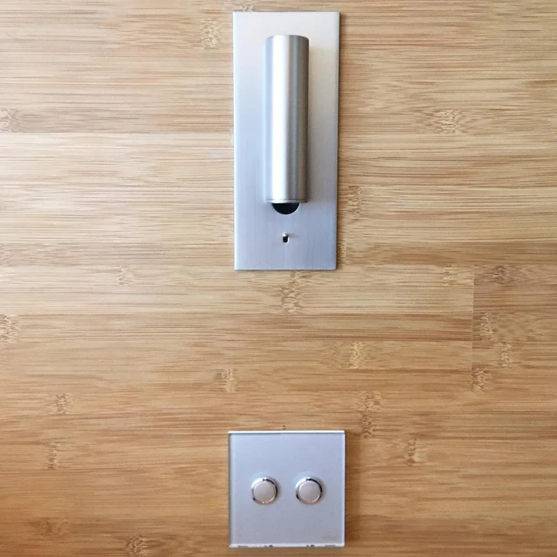 Wall-mounted reading lamp with built-in LED night light