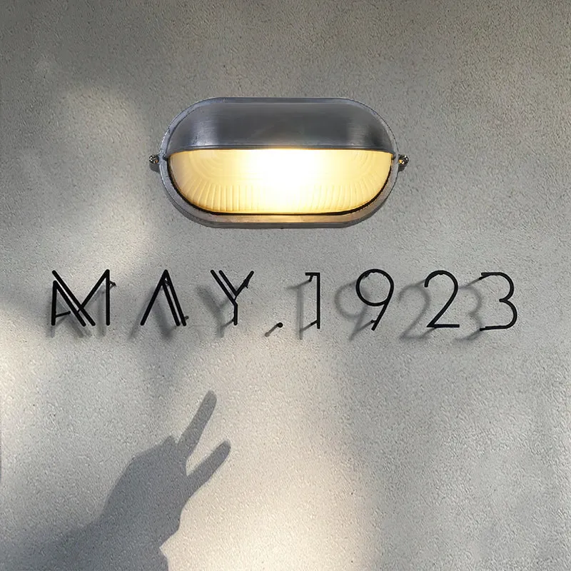 Outdoor industrial bulkhead wall lamp Oval weather-resistant design