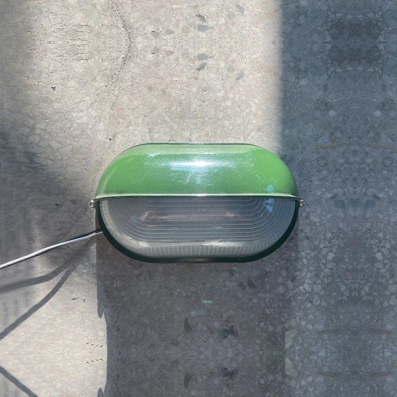Outdoor industrial bulkhead wall lamp Oval weather-resistant design