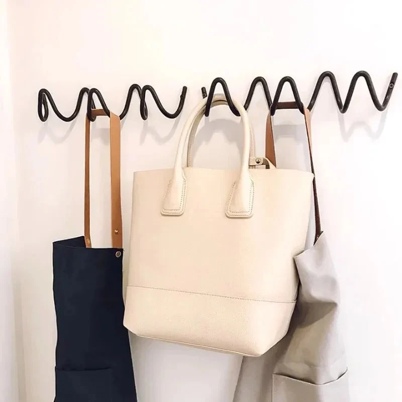 Space-saving wall hanger with multiple hooks wave