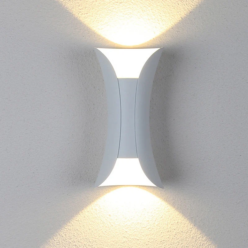 Modern outdoor LED wall light with curved design directing light up and down