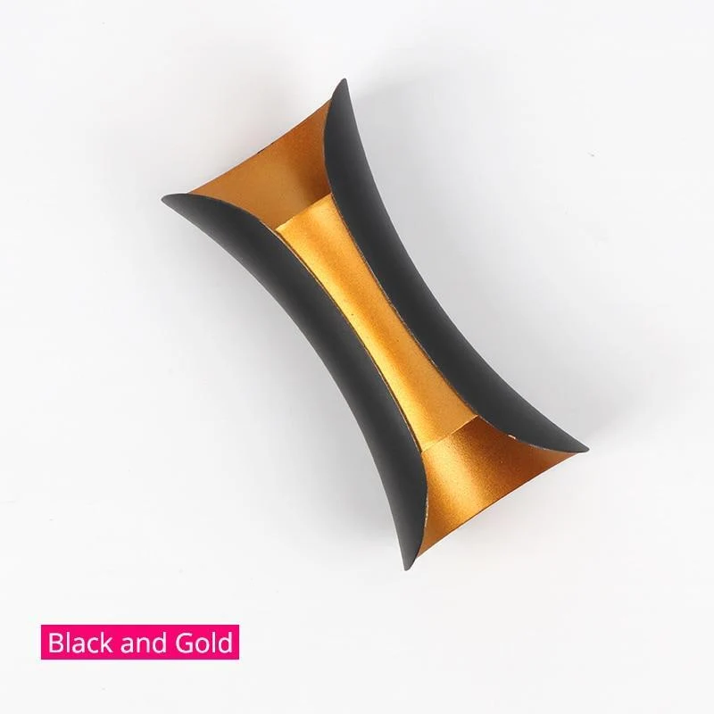 Modern outdoor LED wall light with curved design directing light up and down